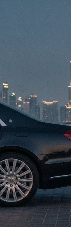 Couple stepping out of a chauffeur-driven luxury car on a Dubai date night