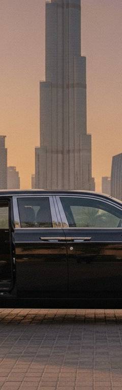 Wedding car with chauffeur waiting outside a Dubai wedding venue